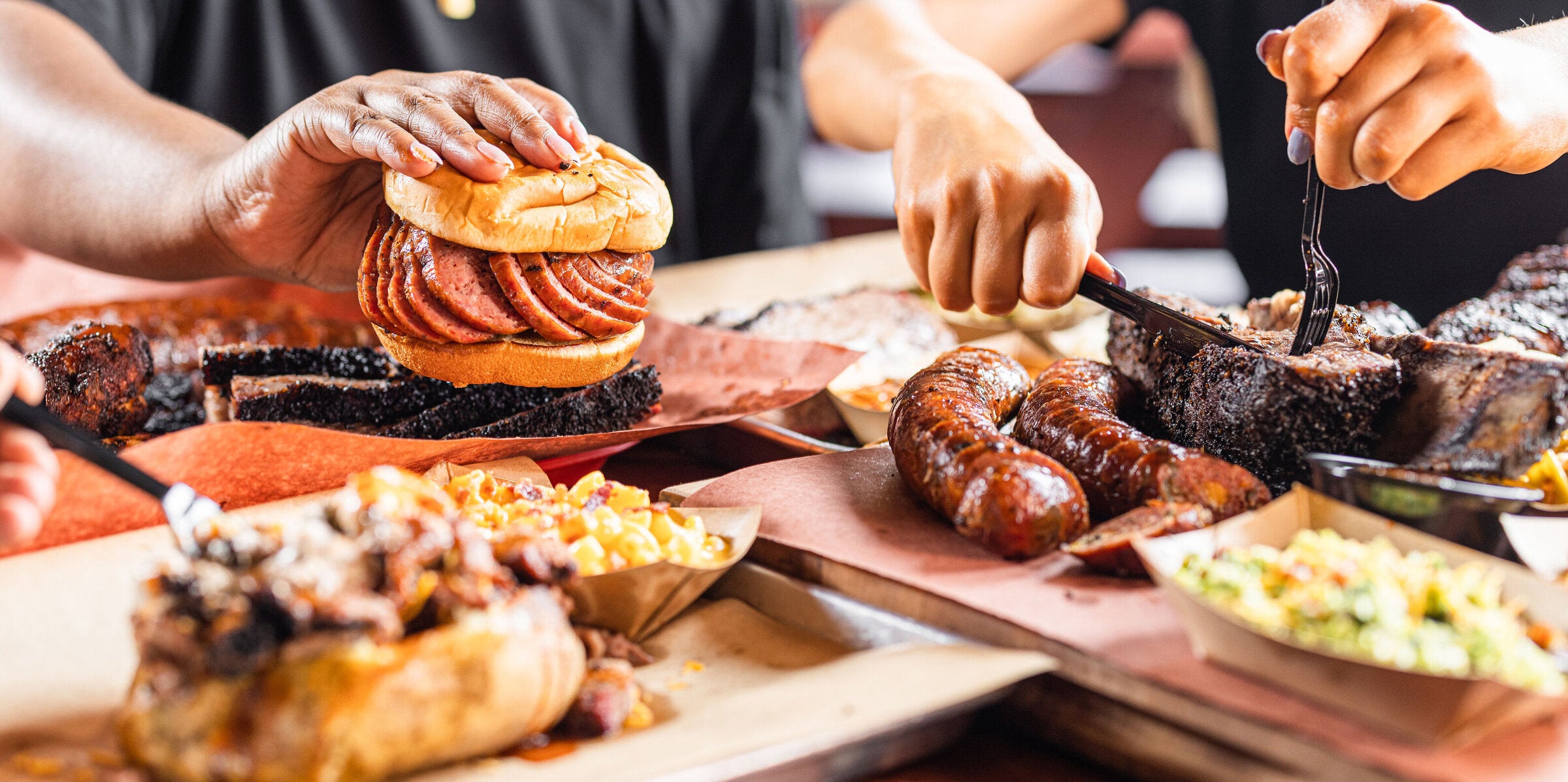 Hutchins BBQ catering spread of smoked meats and sides